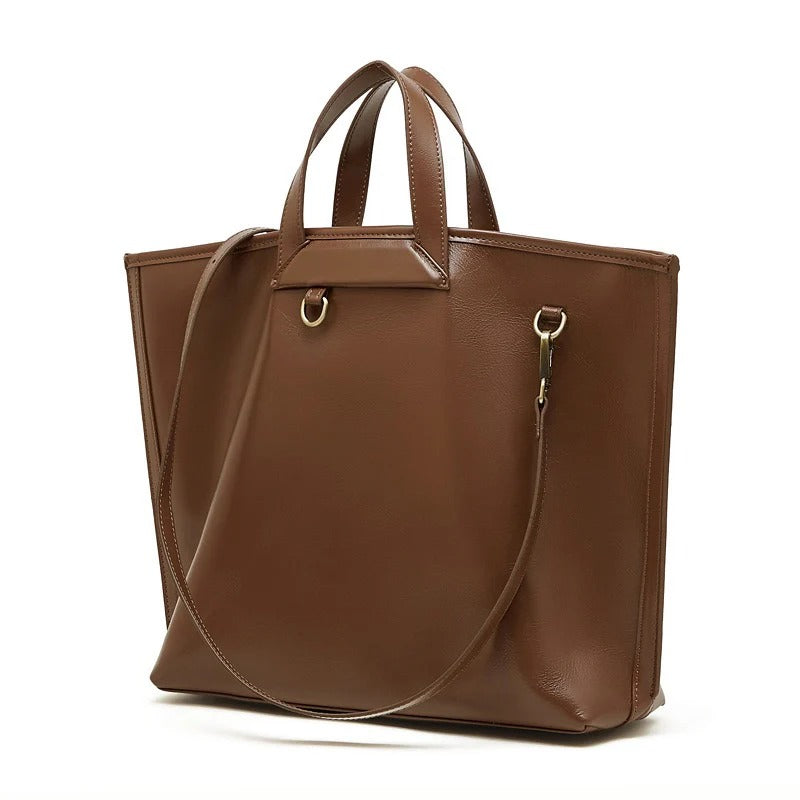 Brown leather tote bag with a shoulder strap