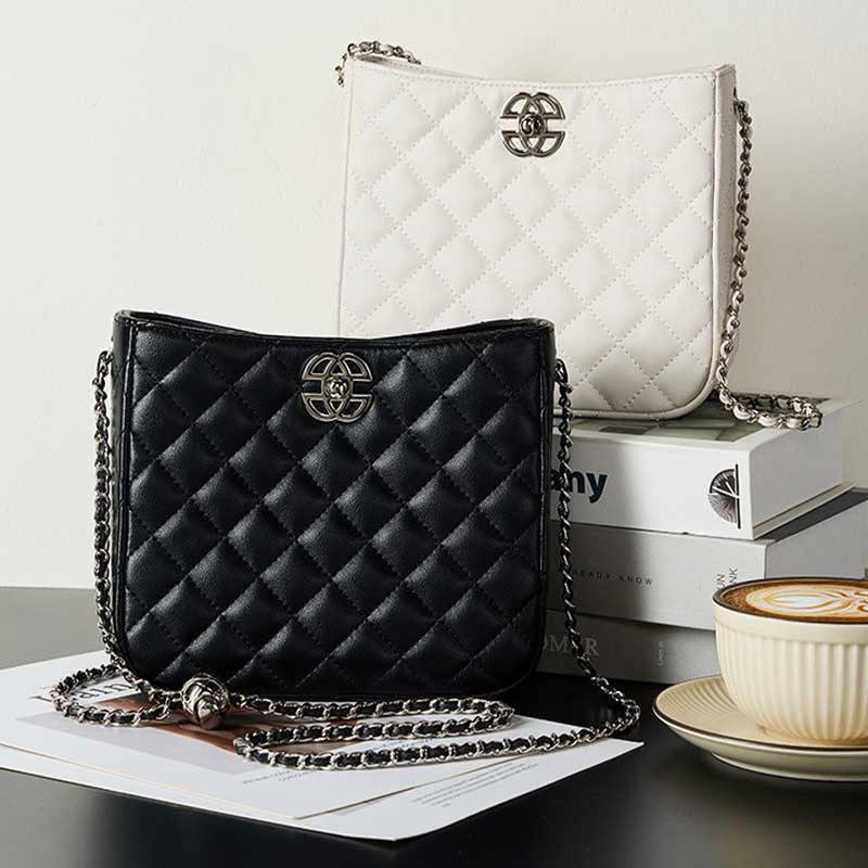 Black and white quilted handbags with chain straps