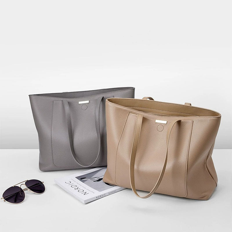 Two handbags, one gray and one beige