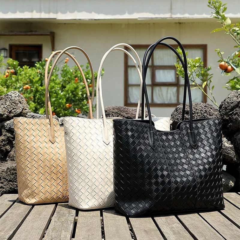 Three woven handbags in khaki, white, and black