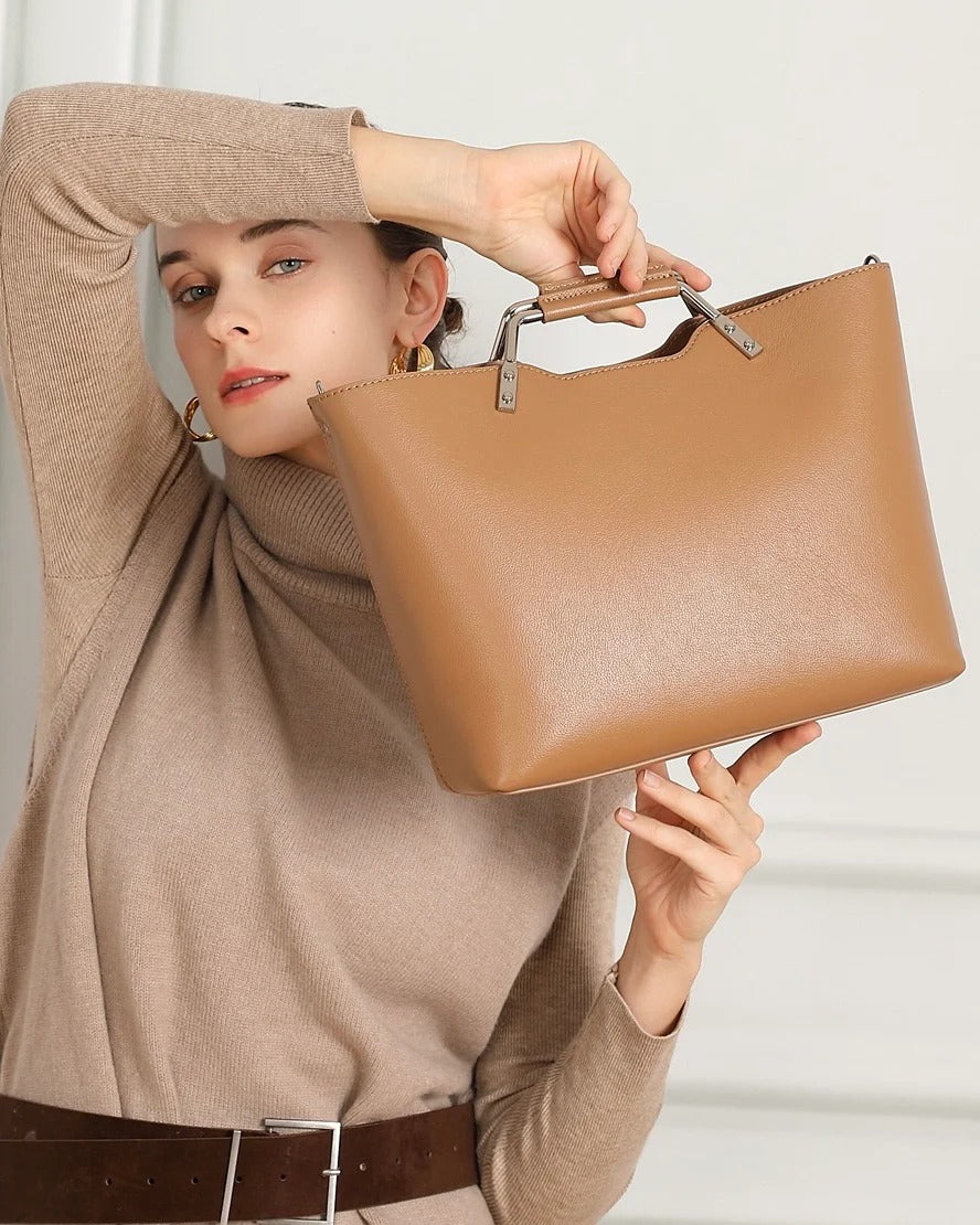 Woman holding a khaki handbag