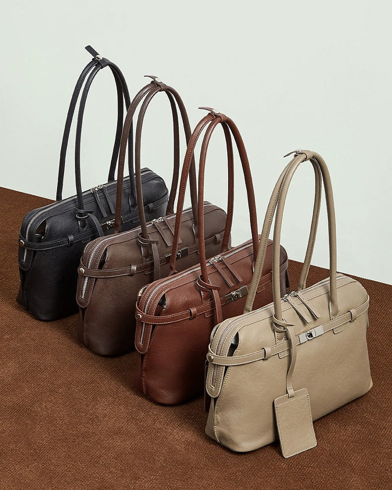 Four handbags in black, brown, and gray