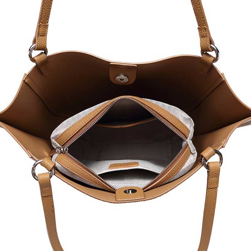 Brown leather handbag with open interior showing a zipper pocket.