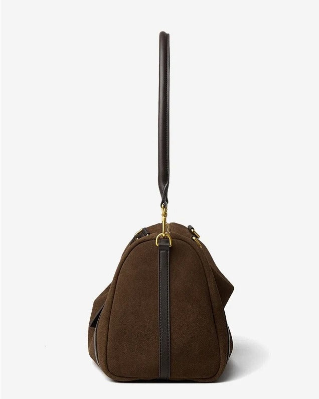 Brown handbag with a black handle on a white background