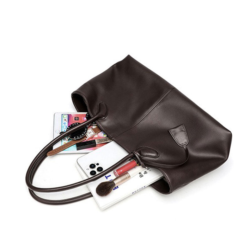coffee leather handbag with various items