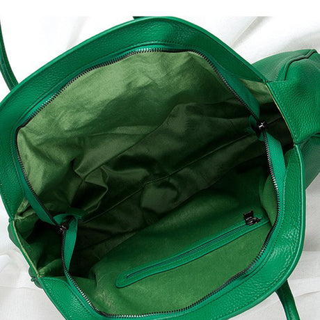 Green cowhide  bag with open interior 