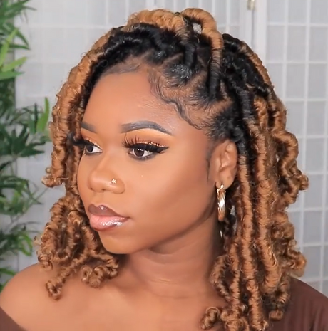 A women wearing a hand braided wig with ombre box braids, featuring a mix of dark and light brown colors.