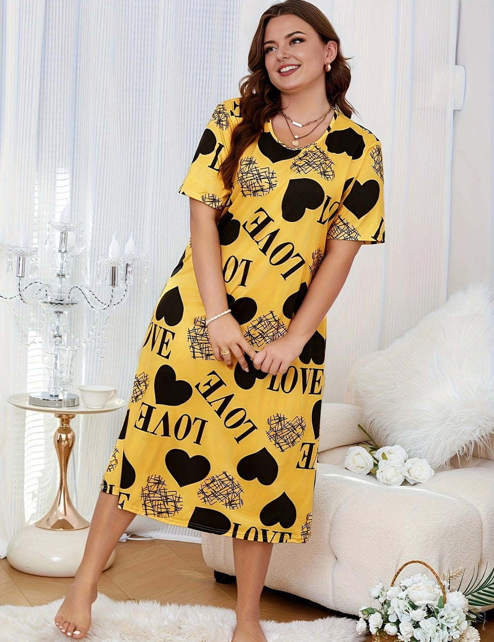 Woman wearing a yellow dress with black heart patterns in a living room setting