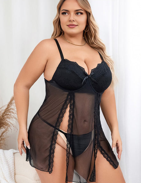 Woman wearing a black lace lingerie set against a white background