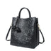 Black Cowhide handbag with floral embossing 