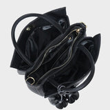 Black handbag with open top and visible interior 