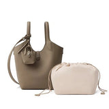 gray leather handbag and beige drawstring pouch