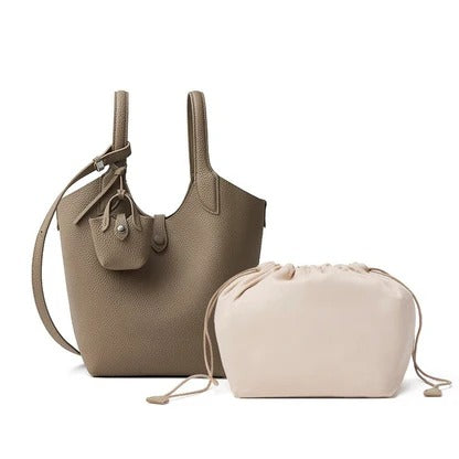 gray leather handbag and beige drawstring pouch