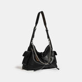 Black handbag with a chain detail 