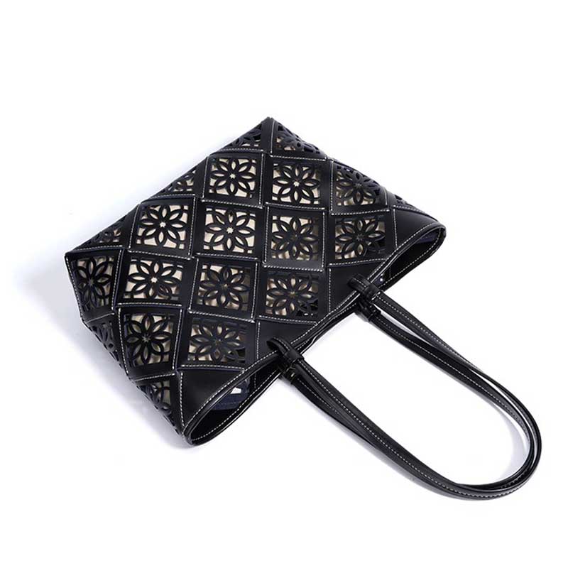 Black handbag with geometric cut-out design 
