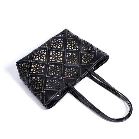 Black handbag with geometric cut-out design 