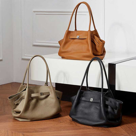 Three handbags in brown, gray, and black 