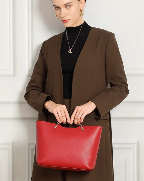 Woman holding a red Genuine Leather handbag 