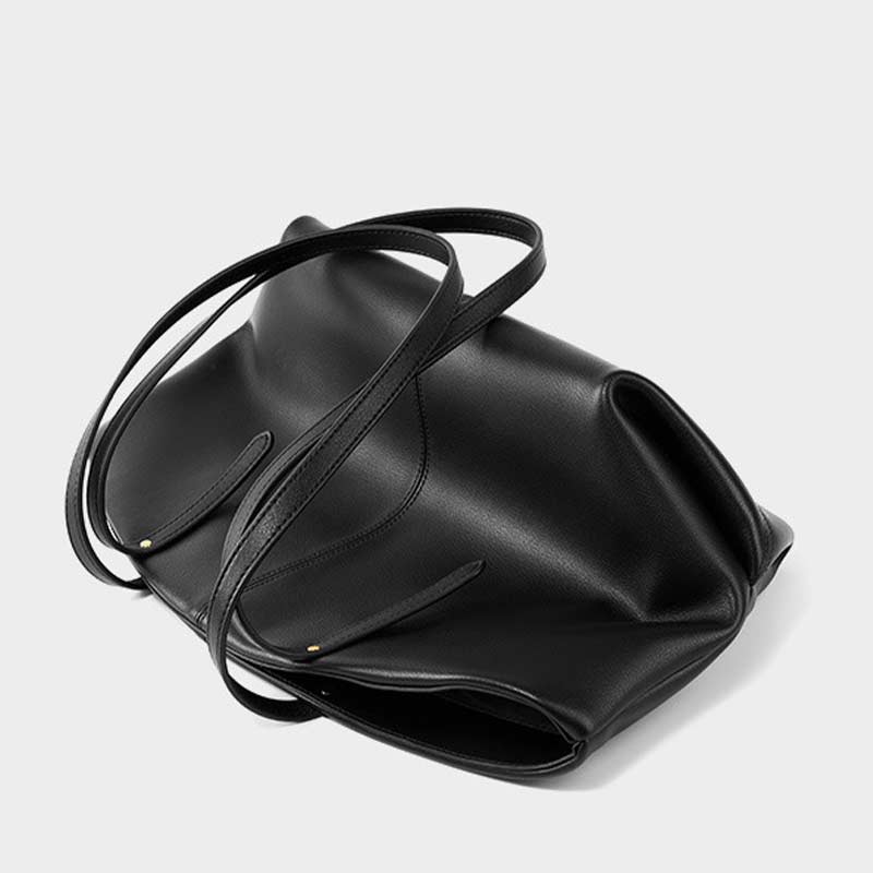 Black leather handbag with a strap 