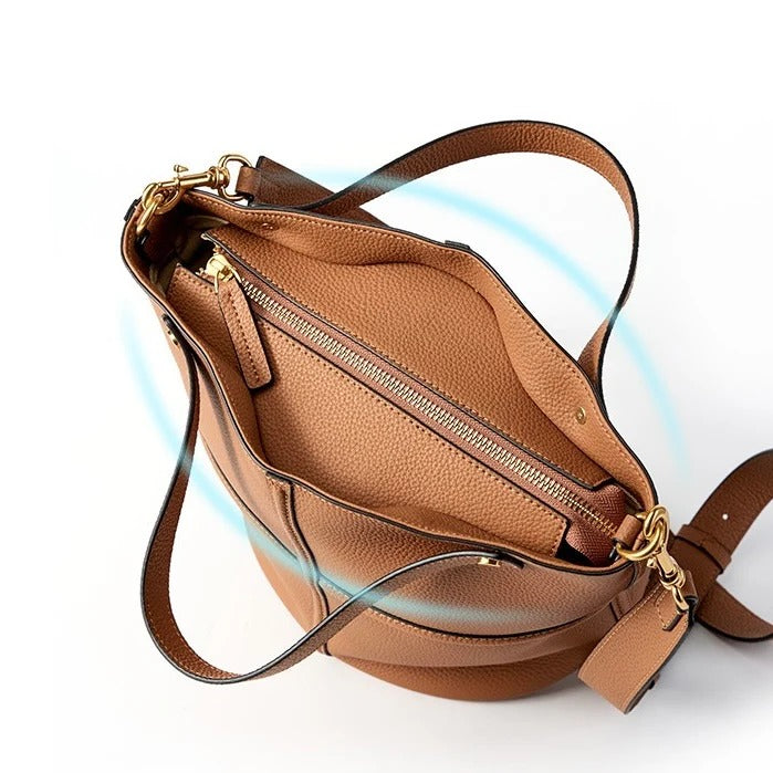 Brown leather handbag with gold zippers