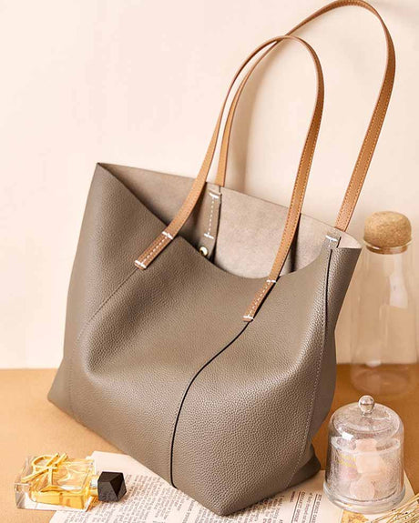 Gray handbag with brown straps