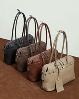 Four handbags in black, brown, and gray