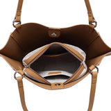 Brown leather handbag with open interior showing a zipper pocket.