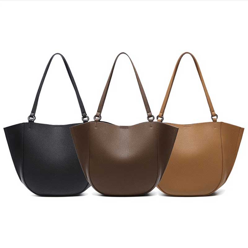 Three leather handbags in black, brown, and brown