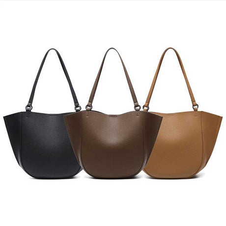 Three leather handbags in black, brown, and brown
