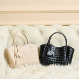 Two Woven handbags, one beige and one black