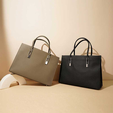Two leather handbags, one gray and one black