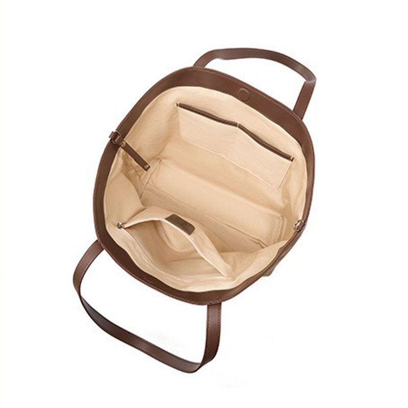 Brown leather bag with beige interior 