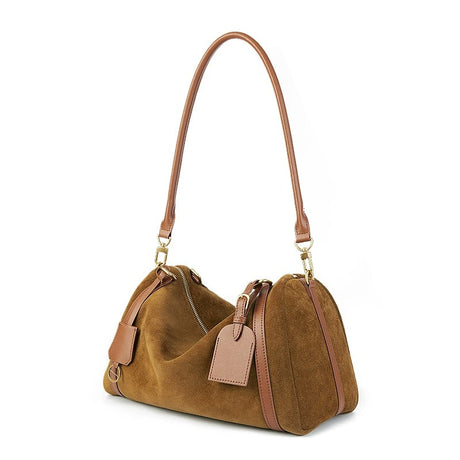 Brown suede handbag with matching strap on a white background