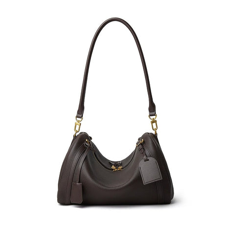 Black handbag with gold accents on a white background