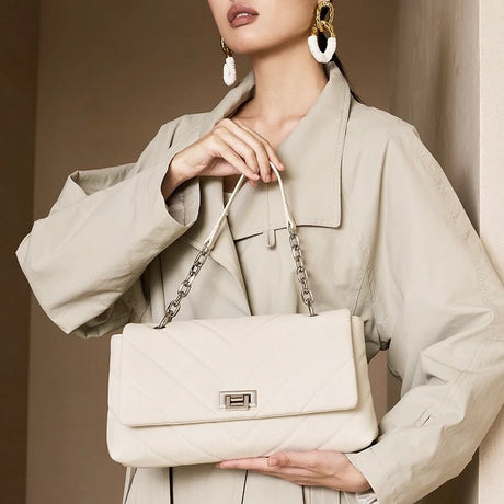 Woman holding a Off-White handbag 