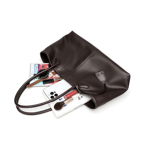 coffee leather handbag with various items 