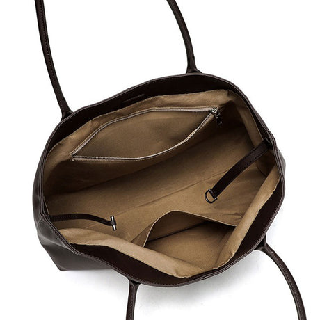 coffee  leather handbag with beige interior 