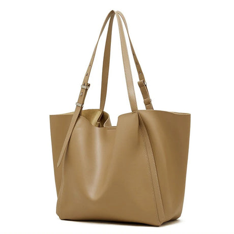 A Turmeric minimalist genuine leather tote bag showing its large, soft structure.