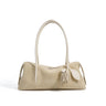 creamy white  Nubuck Leather handbag with a tassel 