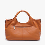 caramel leather handbag back view with a visible zipper 