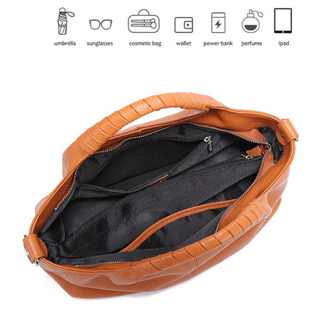 caramel handbag with open lid showing interior 