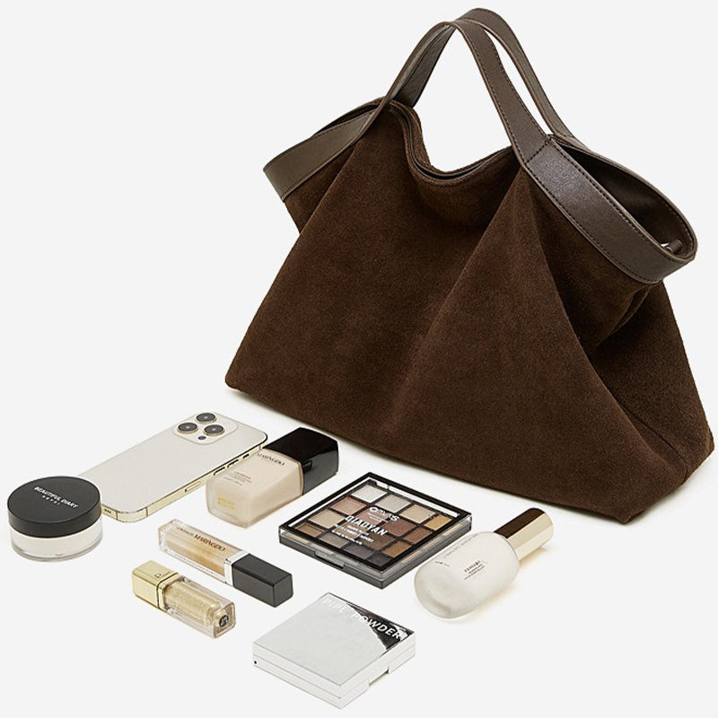 Coffee Brown handbag with makeup items and a phone 