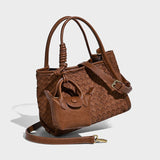 Brown woven handbag with a matching pouch