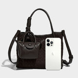 coffee woven handbag with a white phone 