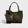 Green woven handbag with a smaller matching pouch 