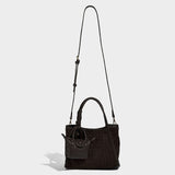 coffee quilted handbag with a strap 