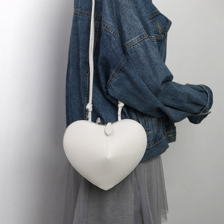 white_leather_heart_zipper_crossbody_mini_bags_3