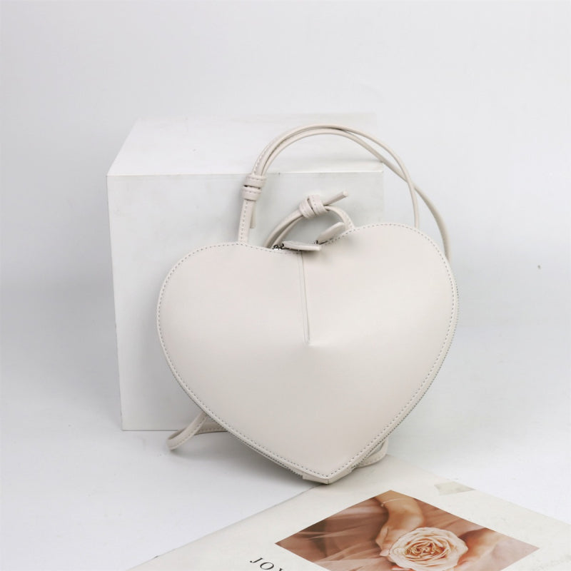 white_leather_heart_zipper_crossbody_mini_bags_5